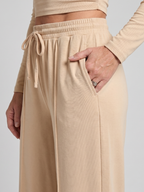 Side view of women's co-ord set with wide leg trousers