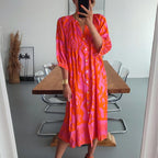 Hot pink and orange print shirred button front midi dress, front view on model