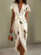 Women's botanical print wrap maxi dress close-up showing print detail