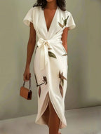 Women's leaf print wrap maxi dress with self-tie belt, elegant wedding guest style, front view
