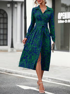 Women's geometric print shirt dress showing tie belt and silky fabric, detail view
