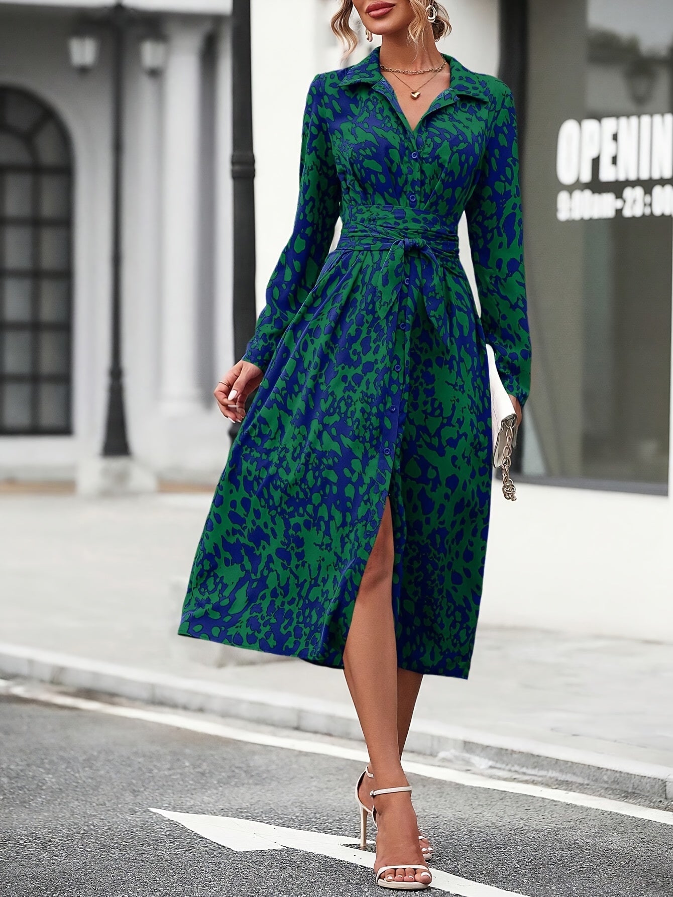 Women's geometric print shirt dress showing tie belt and silky fabric, detail view