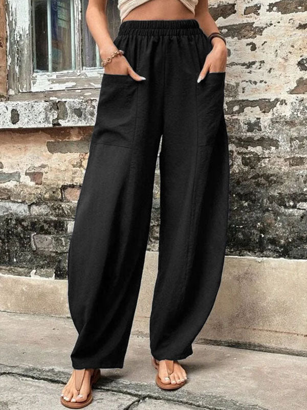 Pink loose fit elastic-waist trousers with pockets, front view