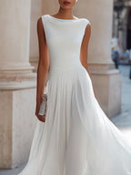Flowing pleated midi dress side view, lightweight fabric