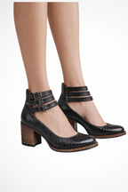 Side view of women's ankle strap heels with multiple buckles
