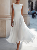 Draped neck sleeveless pleated midi dress in white, front view