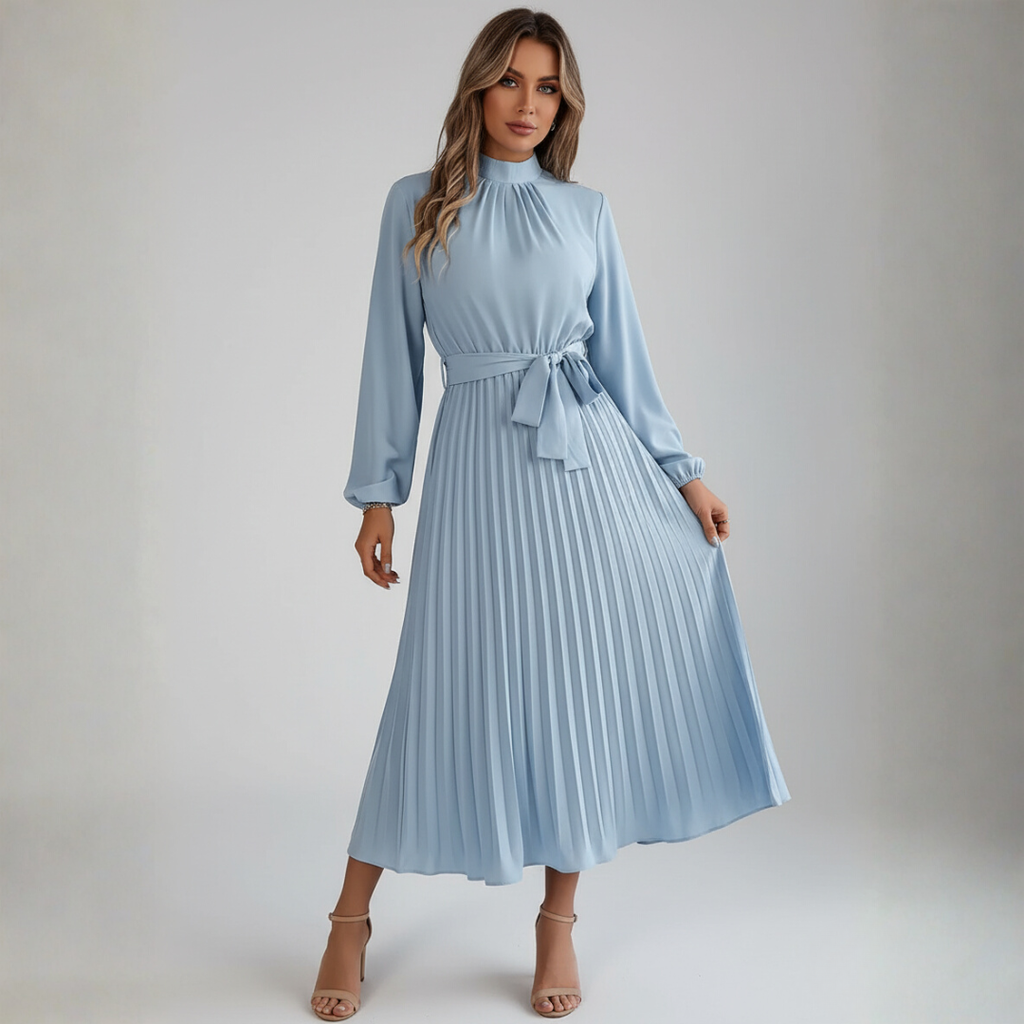 Women's long pleated dress with belt, side profile view