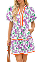 Women's floral patchwork puff sleeve mini dress styled for festivals