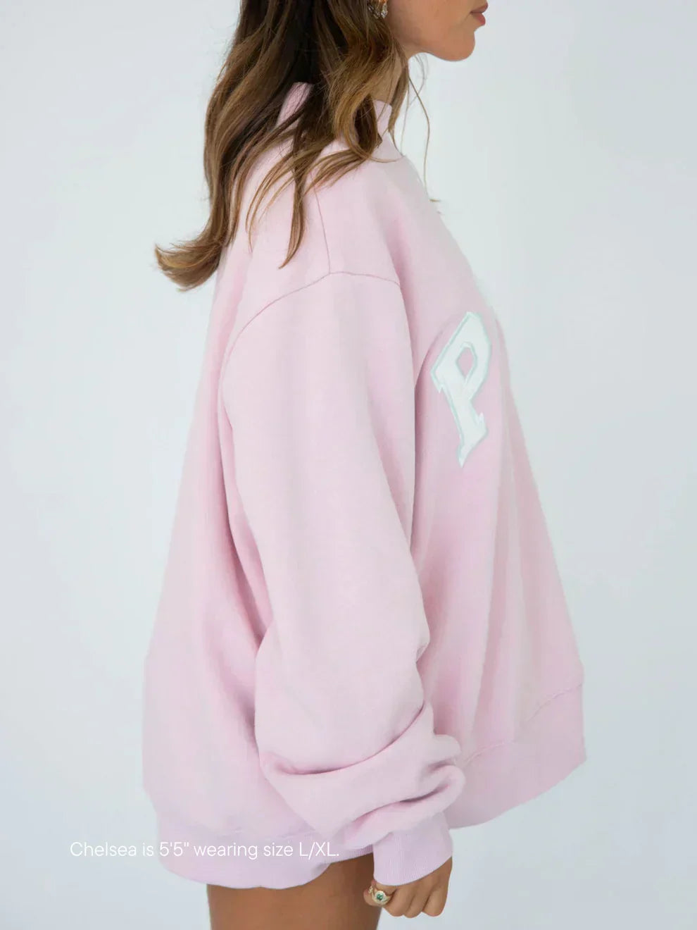 Soft pink varsity mock neck fleece top, side view