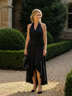 High-low hem detail on women's halter wrap dress