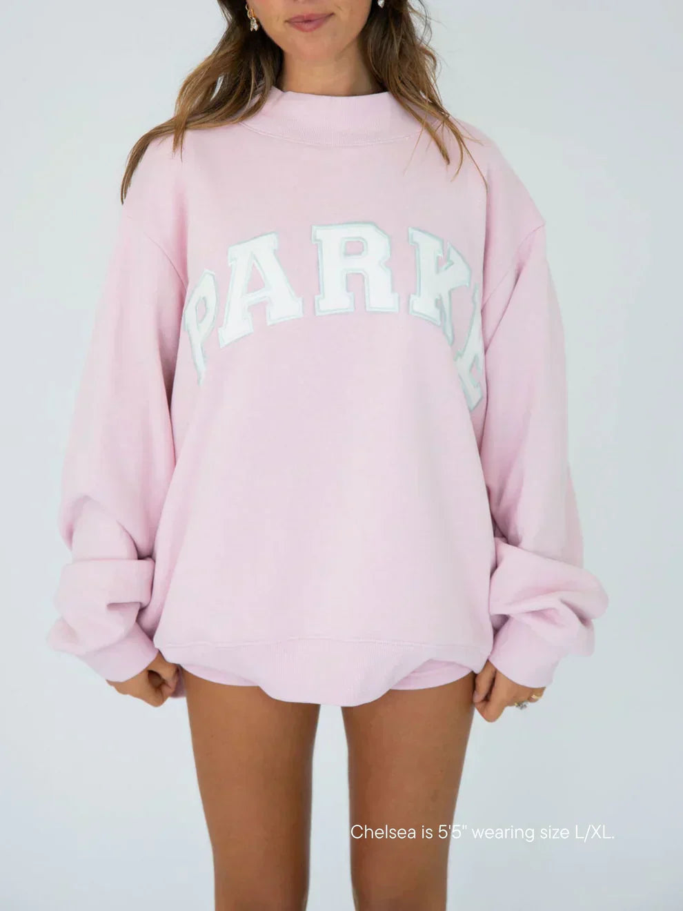 Women's varsity mock neck fleece top in soft pink, front view