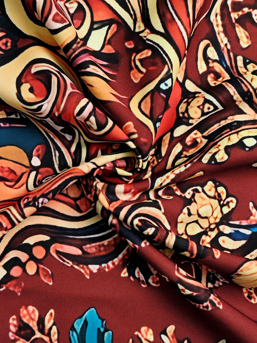 Close-up of the contrast-print fabric texture on the midi dress