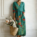 Women's teal floral print V-neck maxi dress with pockets, front view