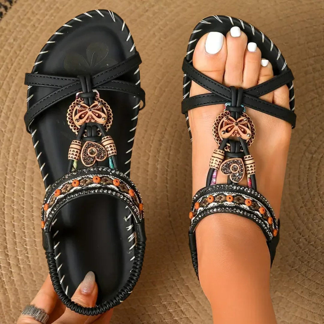 Women's flat sandals with sculpted pearl embellishment, top view