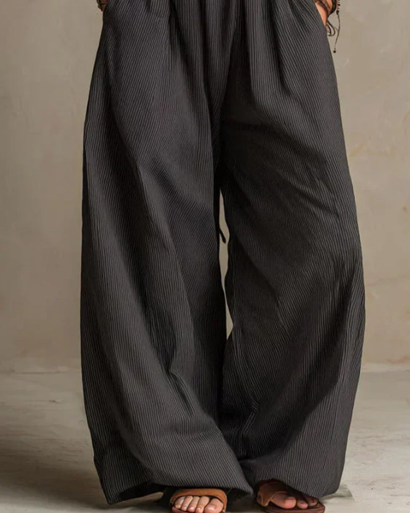 Halter cross strap jumpsuit, side view