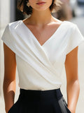 White asymmetric pleated V-neck blouse, front view