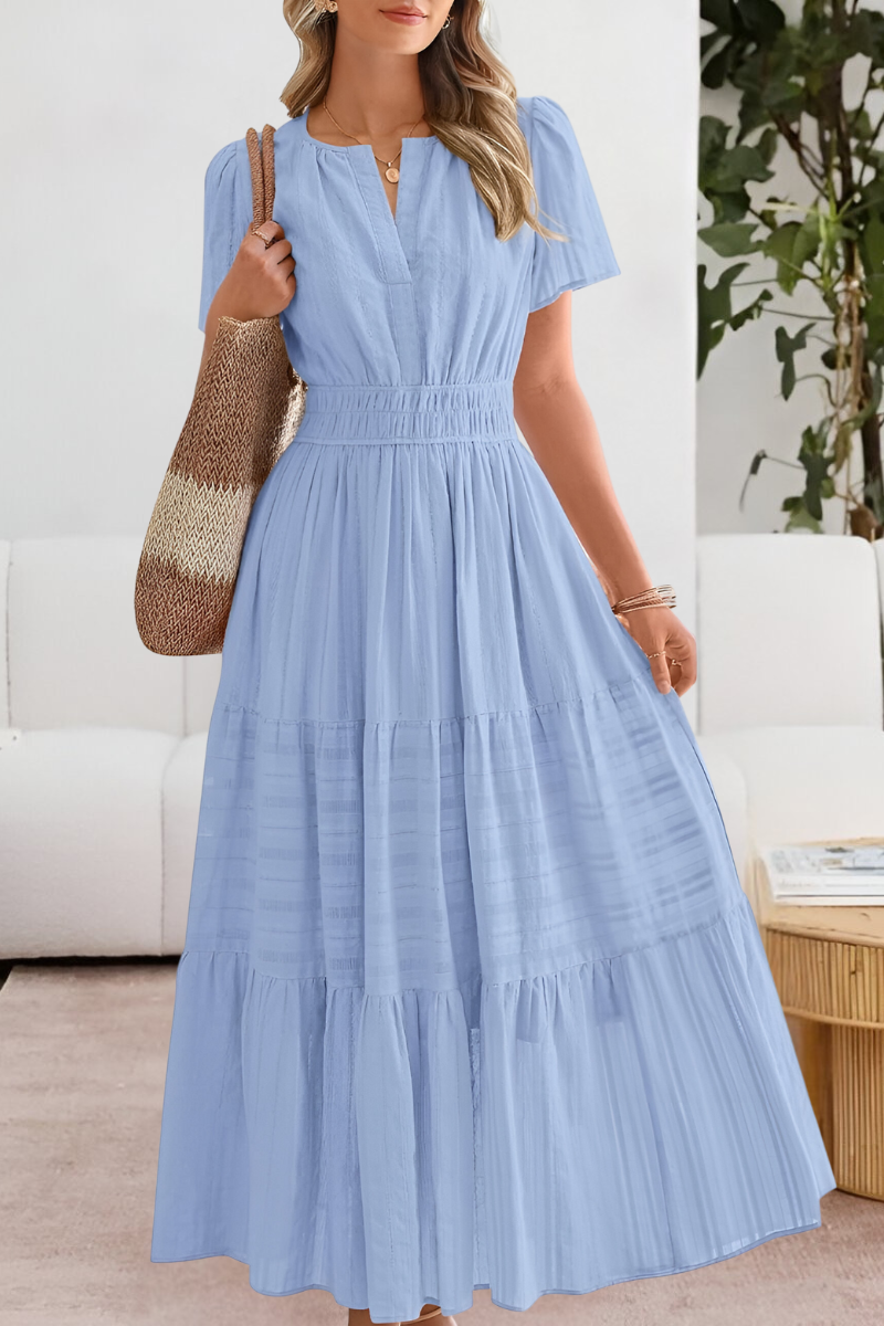 Women's boho cotton A-line midi dress, lifestyle shot outdoors
