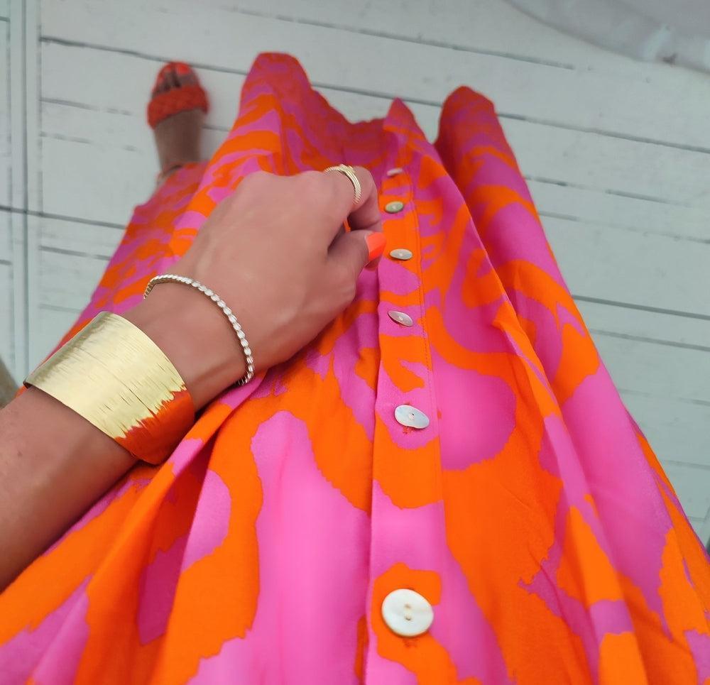 Hot pink orange print midi dress close-up of shirred bodice and collar