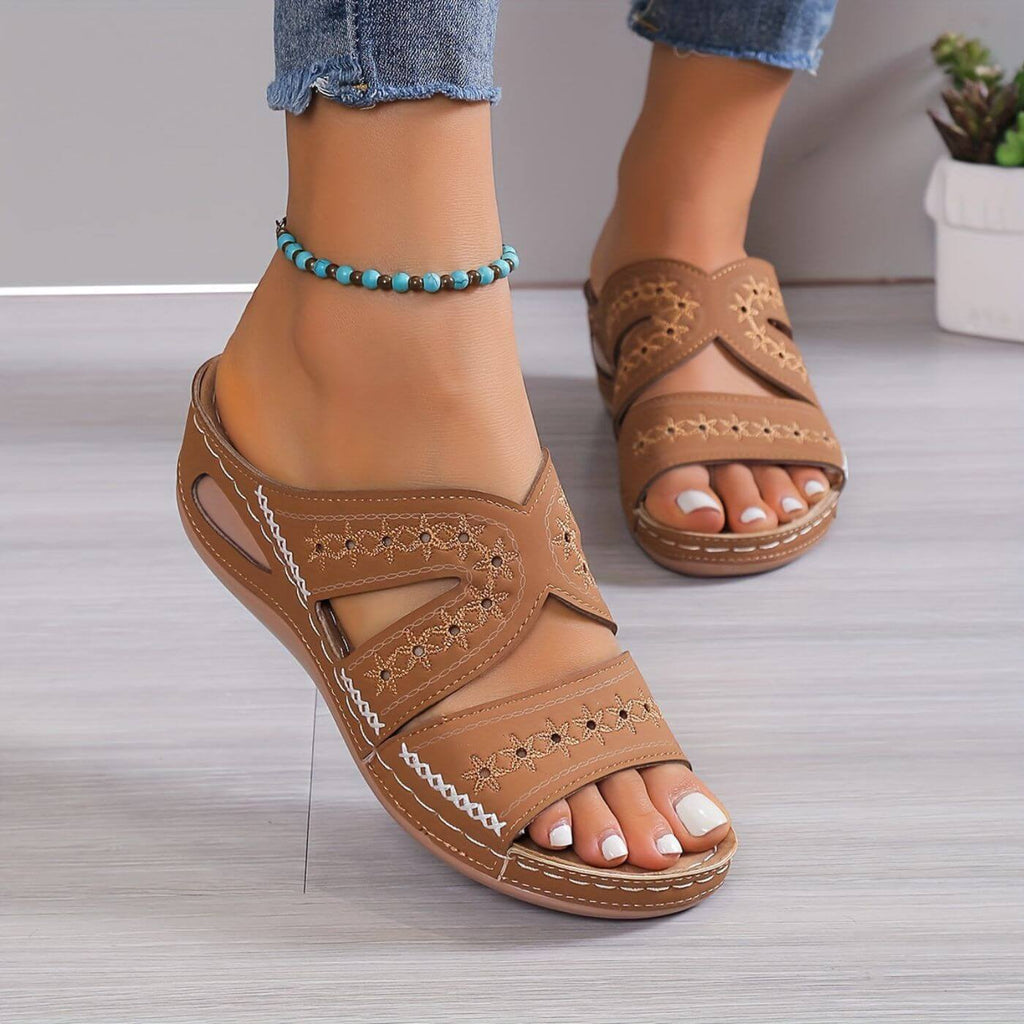 Women's orthopaedic sandals in blue, styled on foot