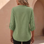 Women's linen blouse with band collar styled for smart-casual