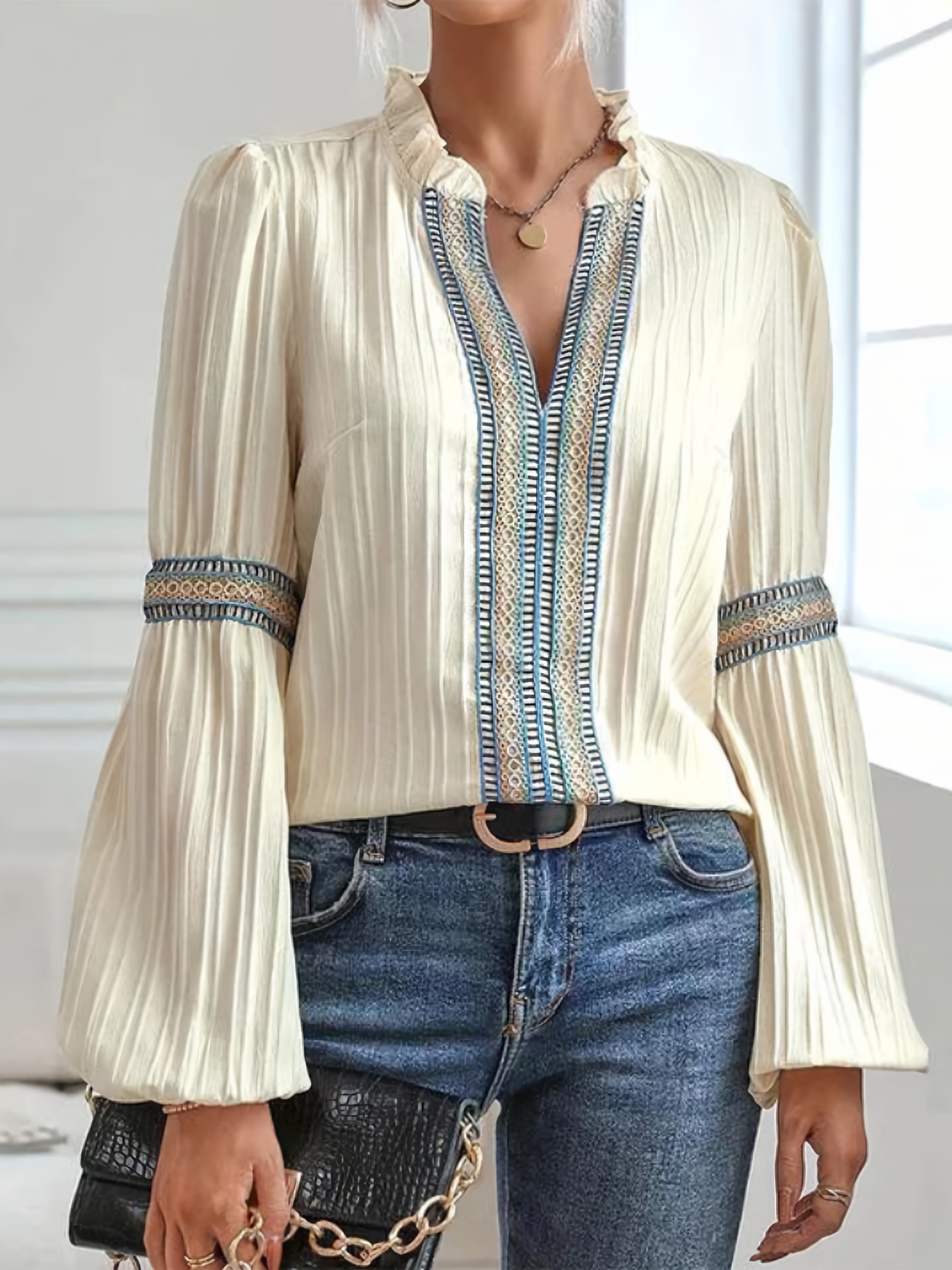 Women's vintage embroidered elegant blouse styled with skirt, back view