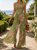 Floral chiffon wide leg V-neck jumpsuit in muted rose and green print, front view