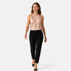 Women's sleeveless satin blouse with pleated neckline, styled look
