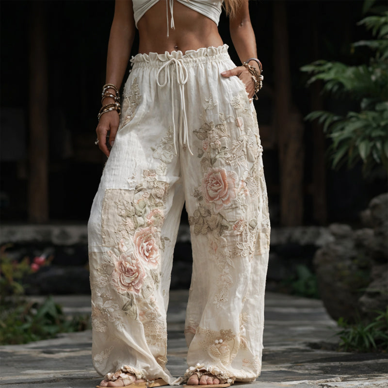 Floral embroidered wide leg pants in beige, front view