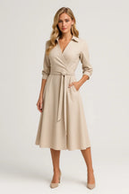 Women's long sleeve wrap midi dress in beige – belted A-line full length view