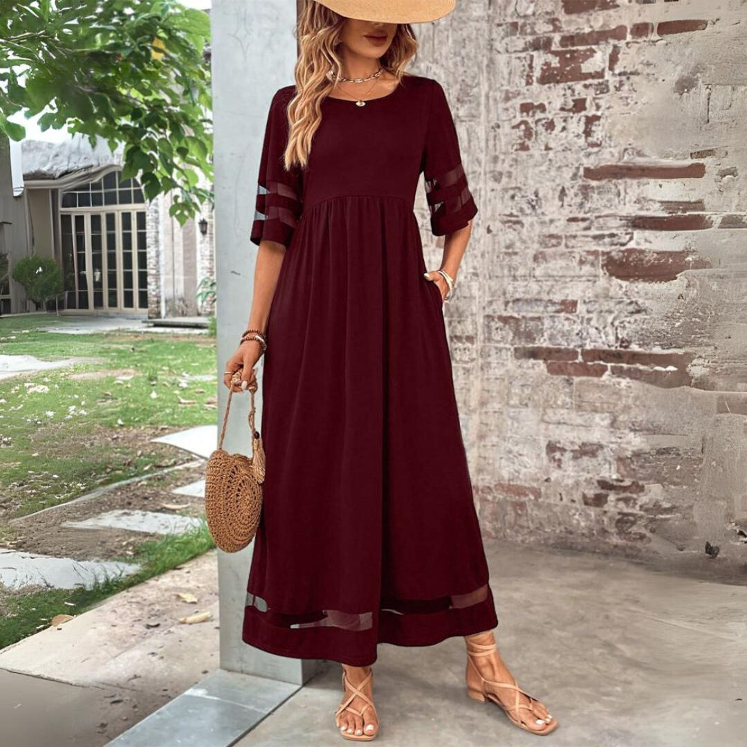 Women's flattering empire waist maxi dress, three-quarter view