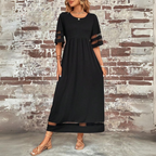 Women's empire waist maxi dress styled for semi-formal occasion