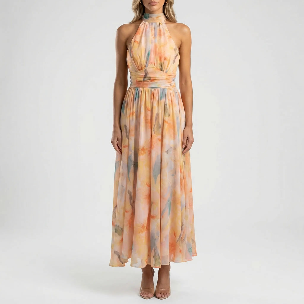 Women's watercolour floral maxi dress with halter neck, full length flowing silhouette