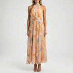 Women's watercolour floral maxi dress with halter neck, full length flowing silhouette