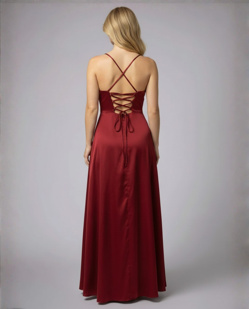 Women's flowing silk maxi dress with braided back, styled occasion look