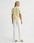 Women's polo collar knit top in yellow – short sleeve back view
