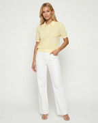 Women's polo collar knit top in yellow – short sleeve relaxed fit front view