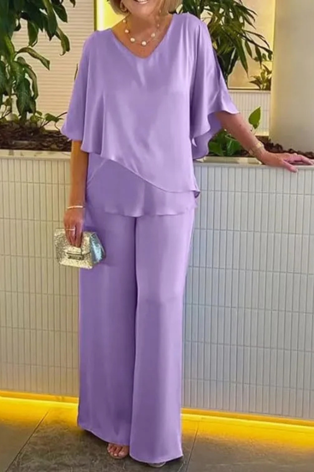 Women's batwing sleeve top and wide leg trousers two piece set, styled outfit