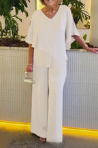 Women's batwing sleeve top and wide leg trousers, model wearing outfit