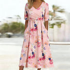 Pink floral midi dress V-neckline detail close-up
