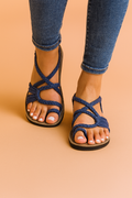 Women's strappy lace-up flat sandals with woven crisscross design, front view