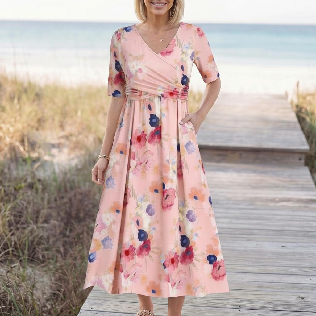 Women's pink floral V-neck midi dress with side pockets, full length front view