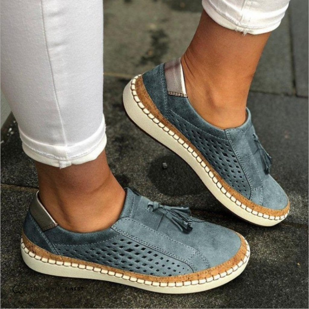 Perforated slip-on shoes in blue grey – vegan leather side view