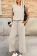 Wide-leg trousers and top co-ord set in beige, front view