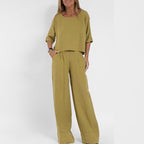 Women's linen co-ord trouser set showing matching top and wide-leg trousers, side view