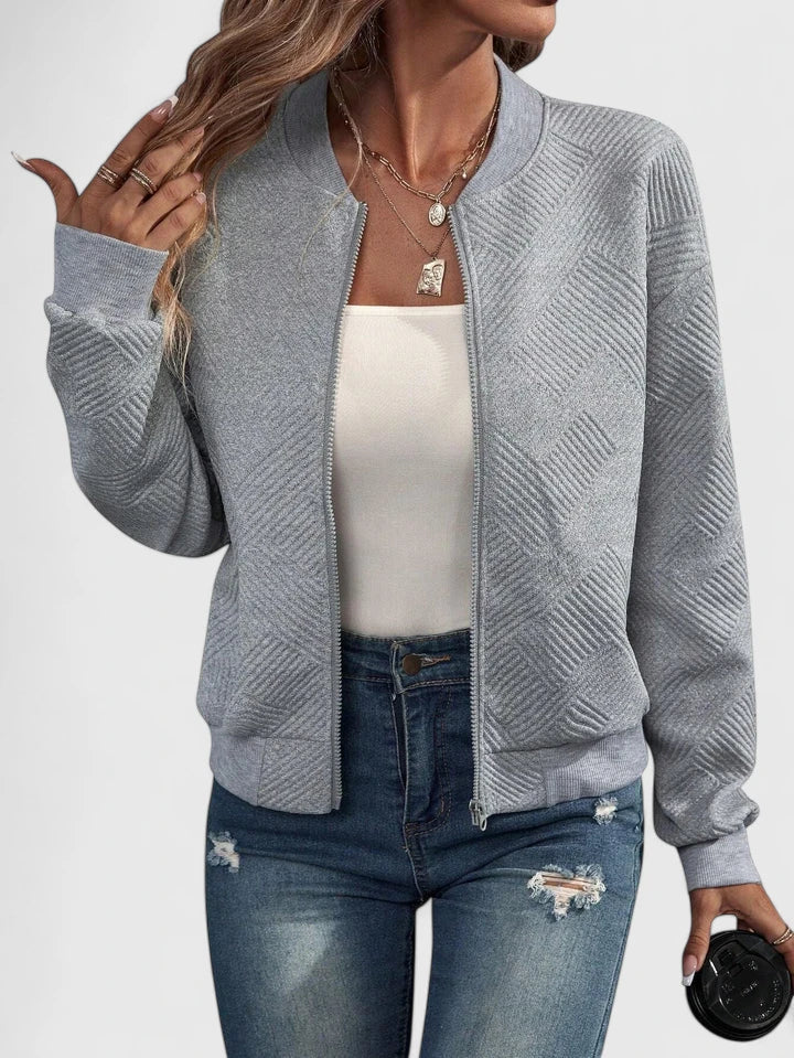 Grey textured geometric bomber jacket with ribbed collar, front view worn open
