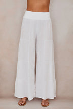 Women's linen palazzo trousers, flowing silhouette detail