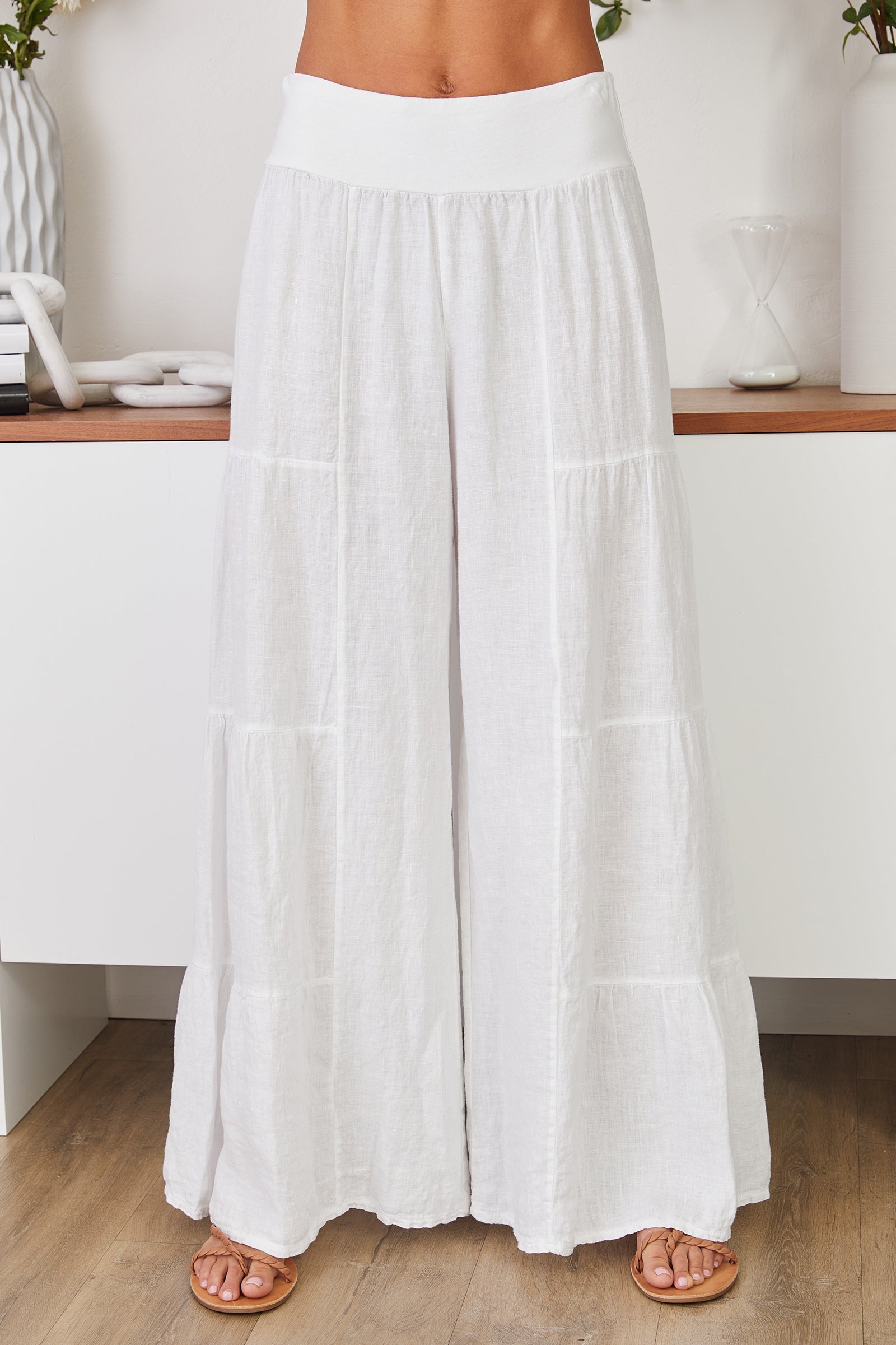 Women's tiered palazzo trousers, close up of tiered hem detail