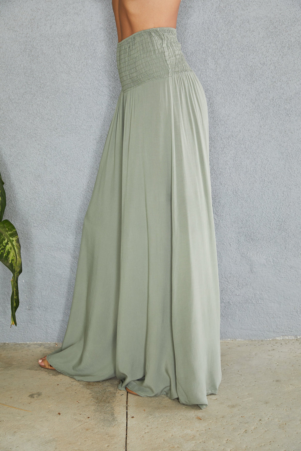 Wide leg trousers showing flowing silhouette and drape