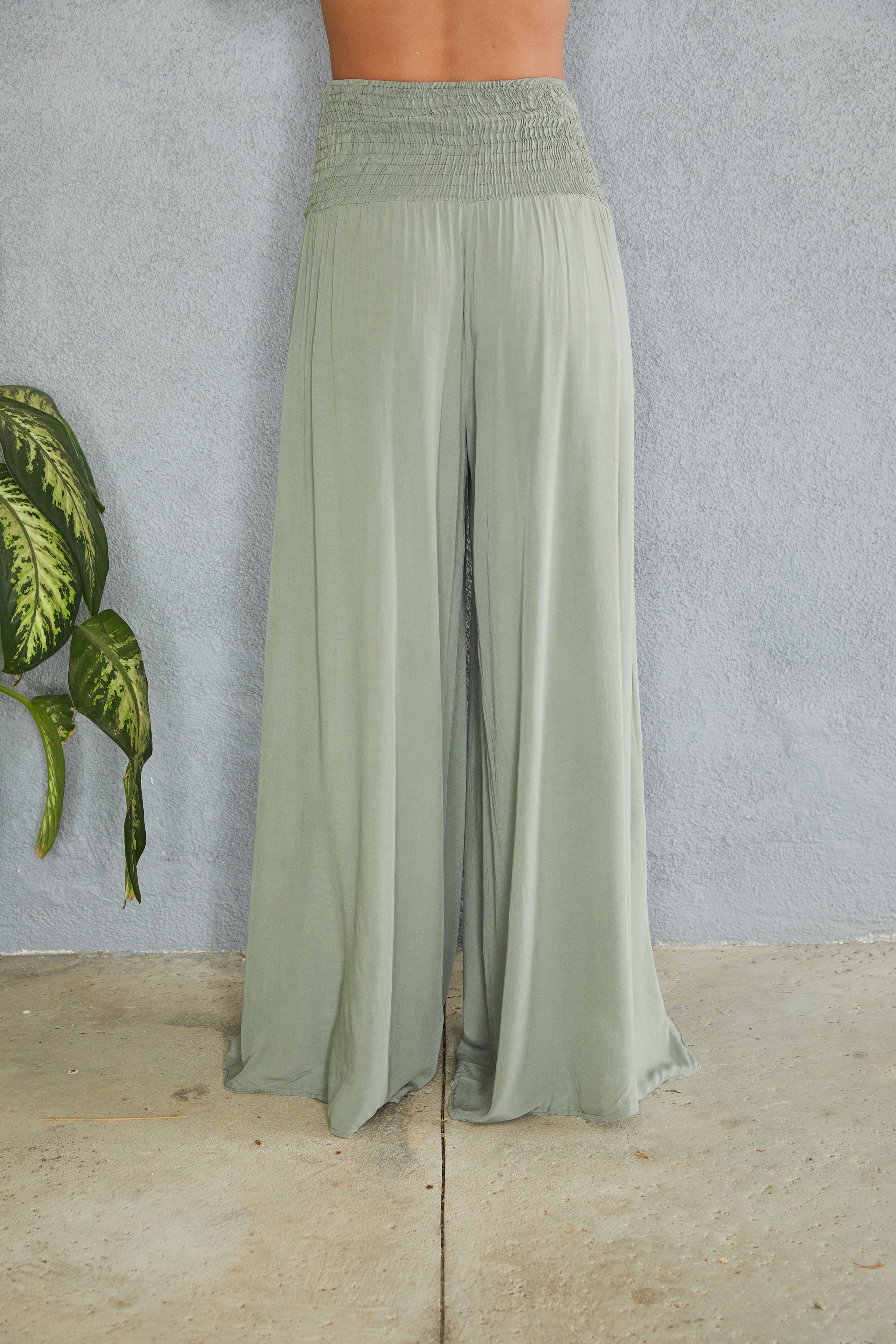 Wide leg smocked waist trousers, styled outfit view