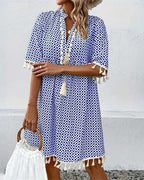 Women's boho geometric print mini dress, styled for beach